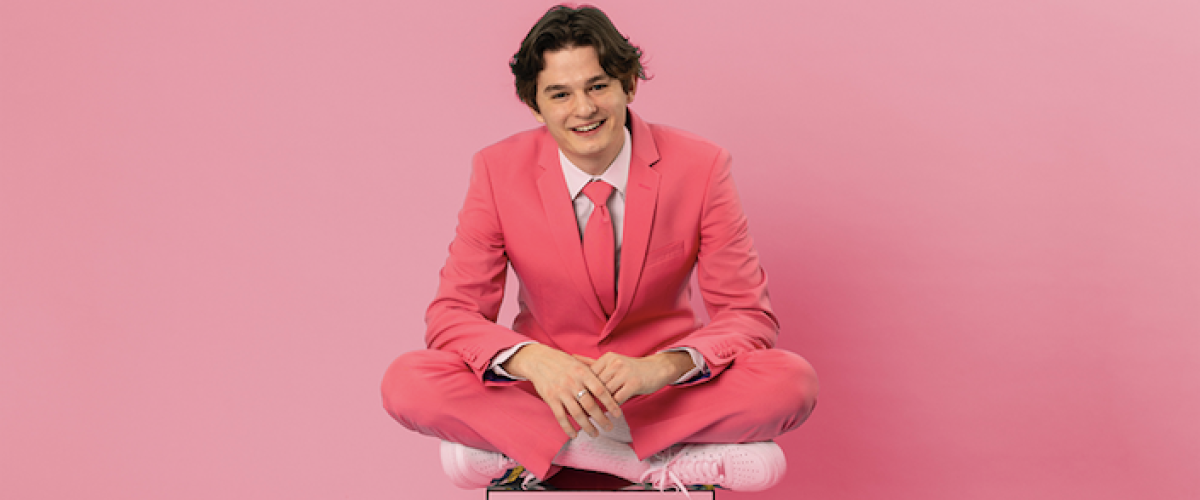 sam and sounds press photo for 'weird day' - dressed in pink in front of pink back drop